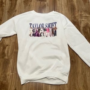 White off-brand Taylor Swift pull over sweater - size large but runs small